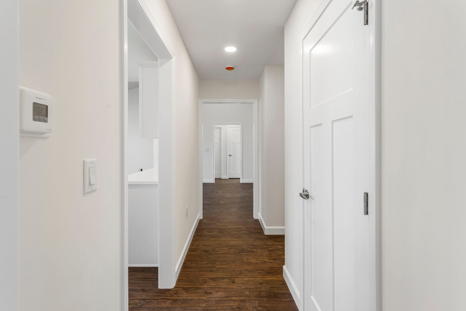 504 Patterson Drive Bloomington, IL 61701 - Photo 9 of 26 a view of a hallway with wooden floor and closet