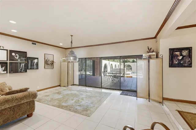 a living room with lots of furniture and a rug
