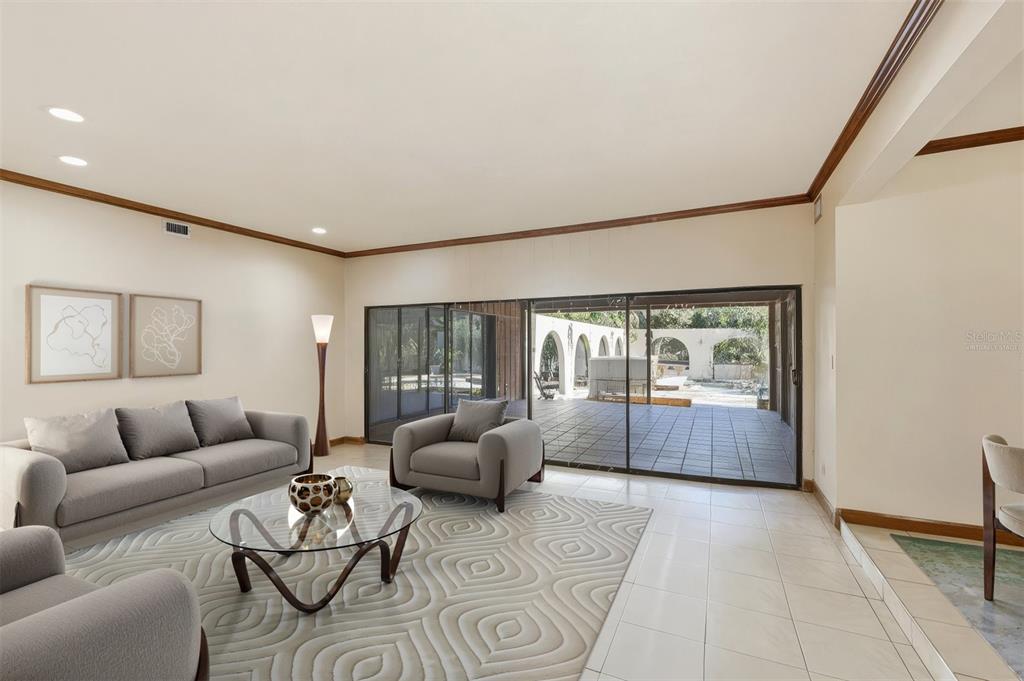 1066 Conover Street Port Charlotte, FL 33952 - Photo 13 of 80 a living room with furniture and a large window