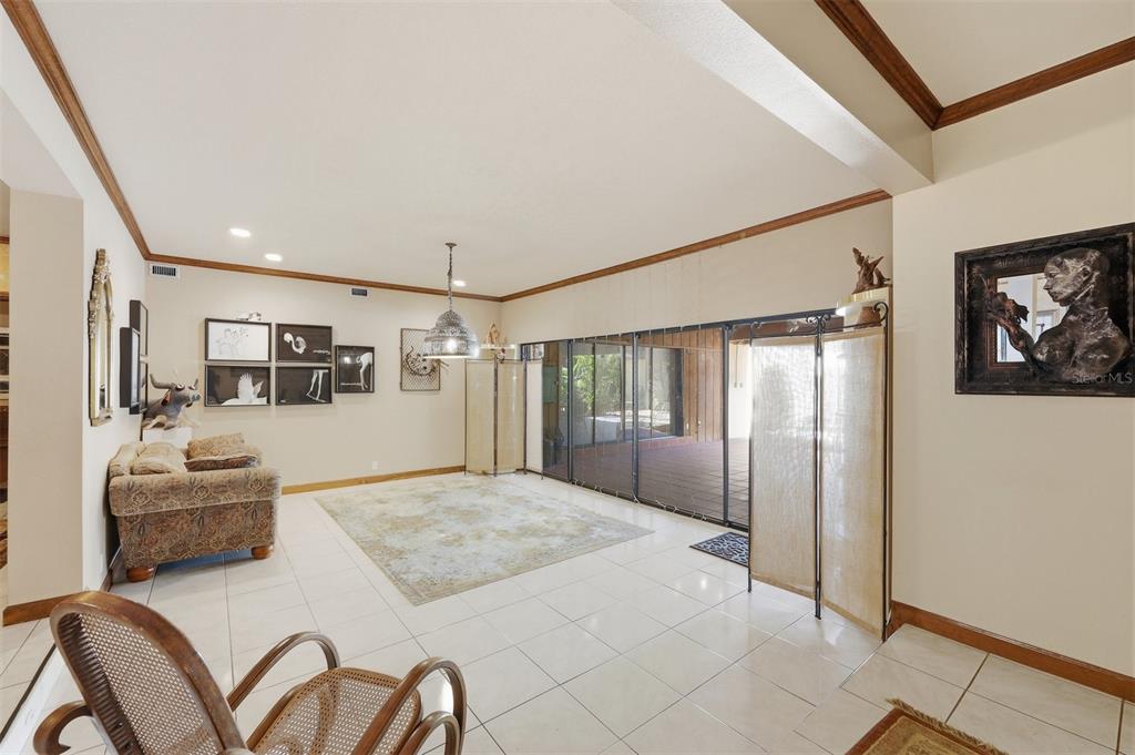 1066 Conover Street Port Charlotte, FL 33952 - Photo 15 of 80 a spacious bedroom with a large bed and a couch
