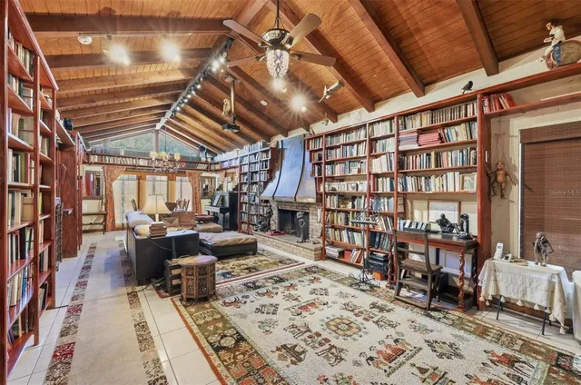 a bedroom with a bed and glass window