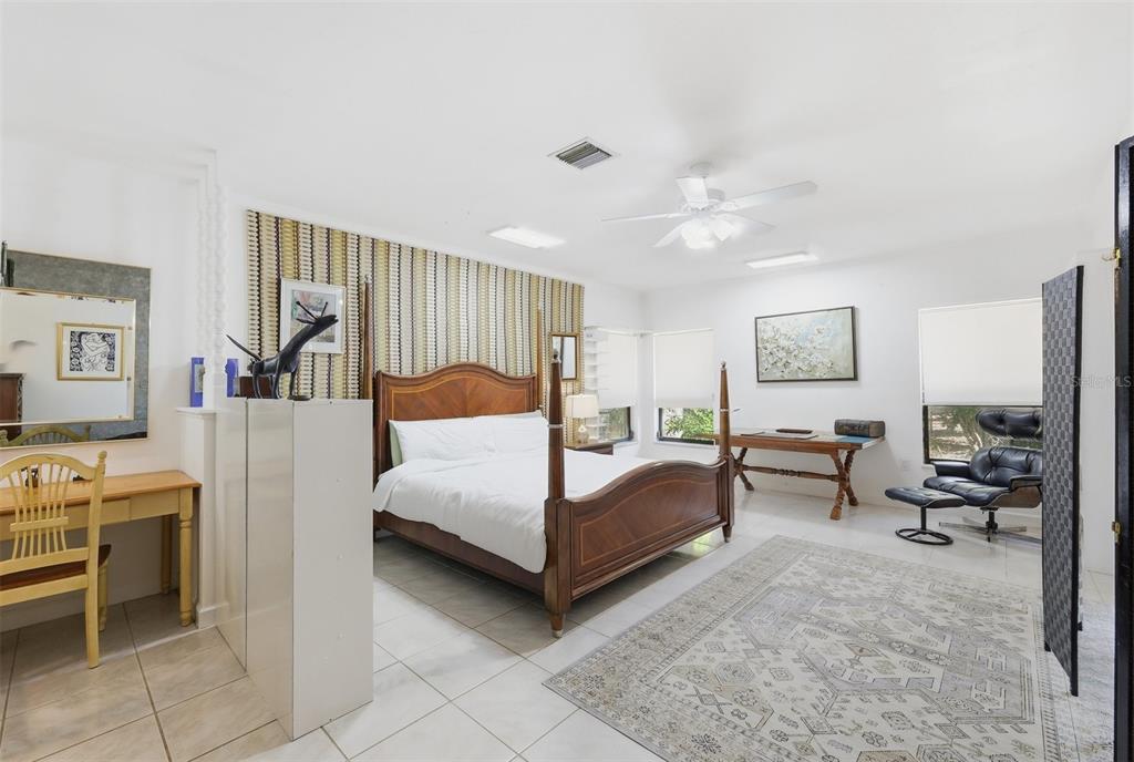 1066 Conover Street Port Charlotte, FL 33952 - Photo 30 of 80 a bedroom with furniture and a flat screen tv