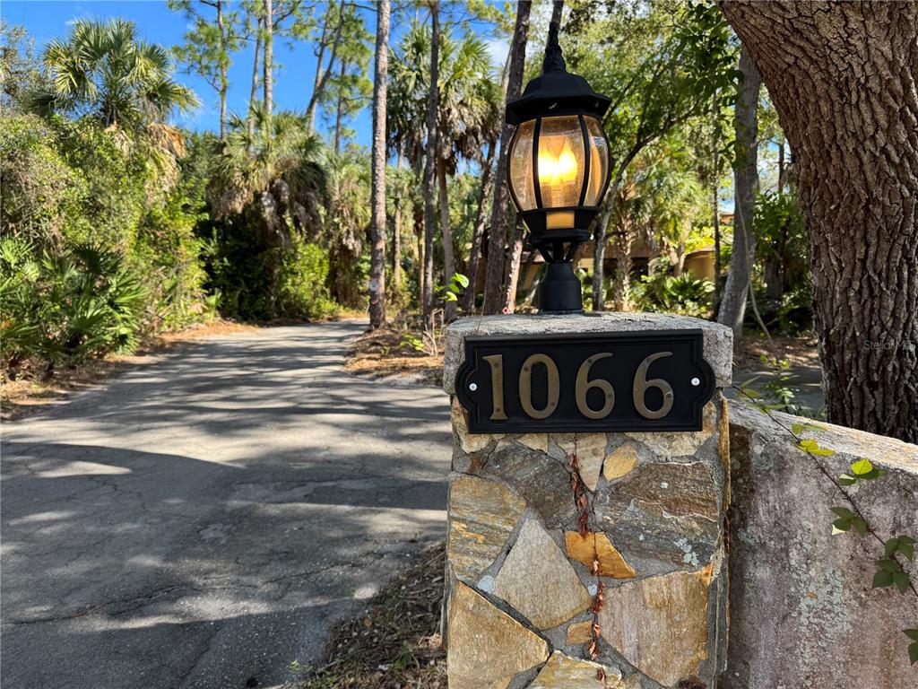 1066 Conover Street Port Charlotte, FL 33952 - Photo 3 of 80 a street sign that is on a tree
