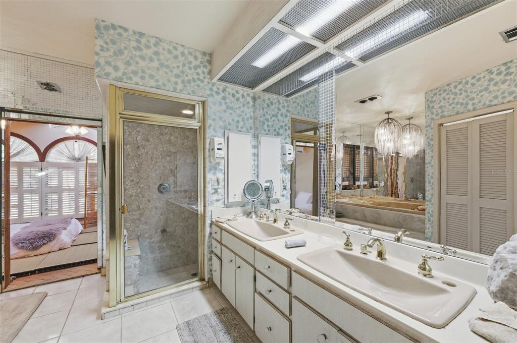 1066 Conover Street Port Charlotte, FL 33952 - Photo 35 of 80 a bathroom with a double vanity sink mirror and shower