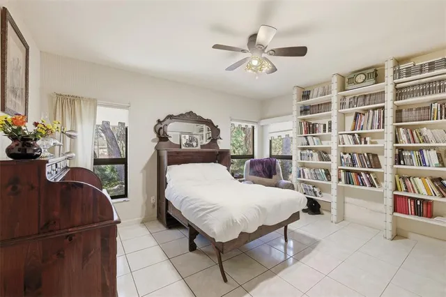 a view of a porch with furniture and wooden floor