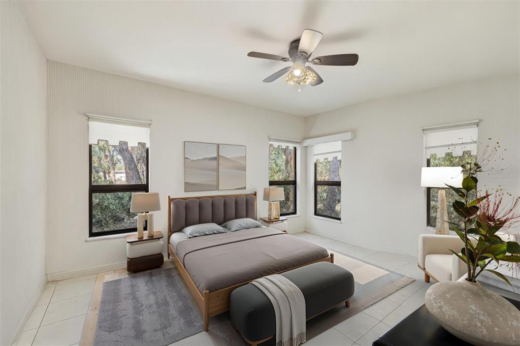 1066 Conover Street Port Charlotte, FL 33952 - Photo 39 of 80 a bedroom with a large bed and windows