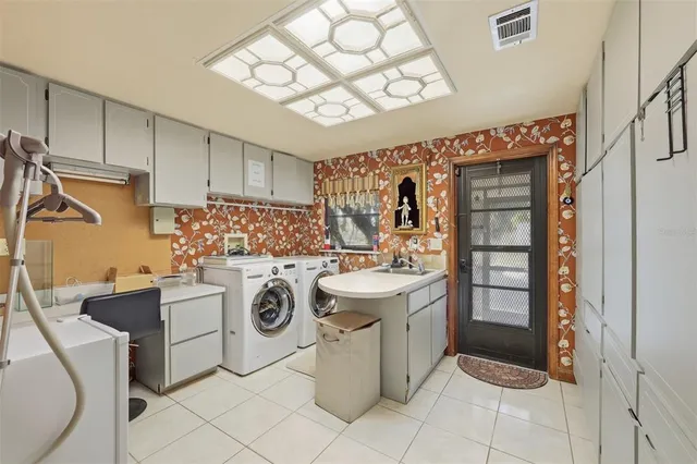 a view of a chairs and table in the back yard of the house