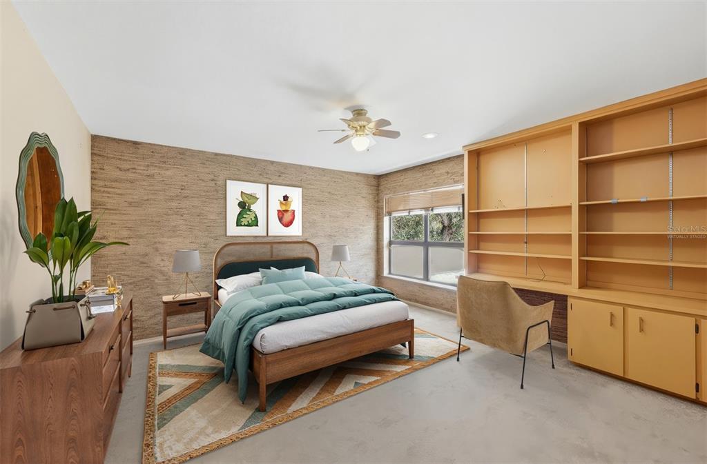 1066 Conover Street Port Charlotte, FL 33952 - Photo 44 of 80 a bedroom with a bed table chair and a window