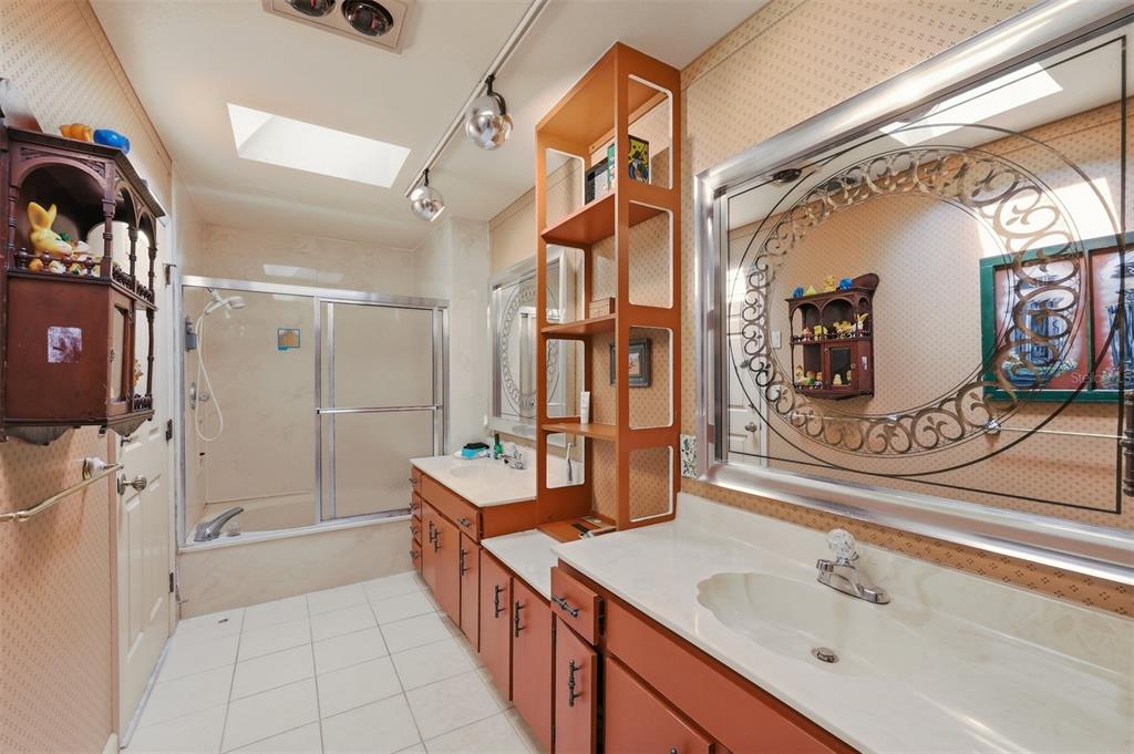 1066 Conover Street Port Charlotte, FL 33952 - Photo 47 of 80 a spacious bathroom with a double vanity sink mirror and shower