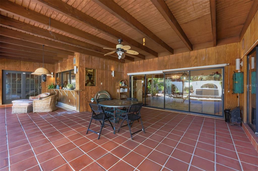 1066 Conover Street Port Charlotte, FL 33952 - Photo 51 of 80 a outdoor space with lots of furniture and a rug
