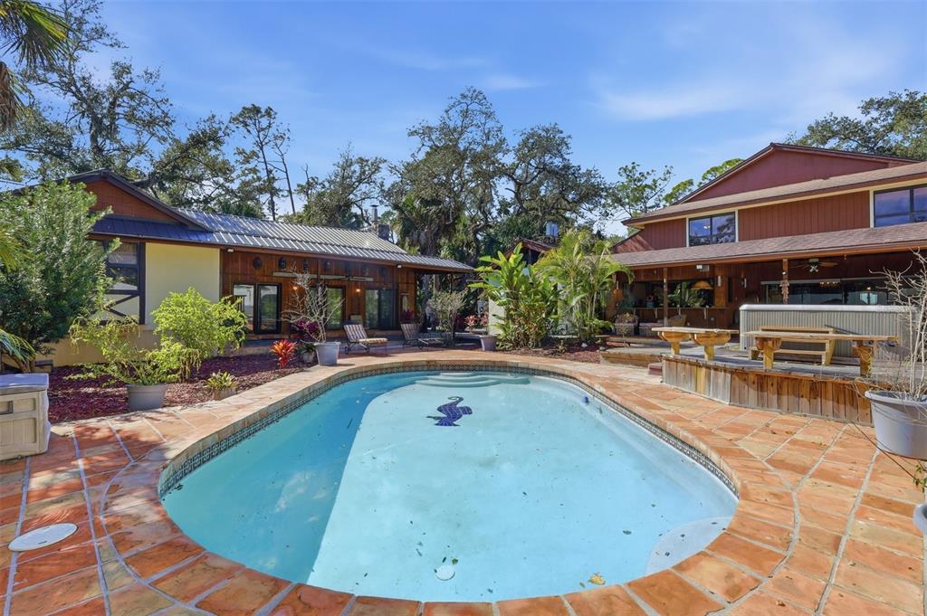 1066 Conover Street Port Charlotte, FL 33952 - Photo 57 of 80 a view of a house with swimming pool
