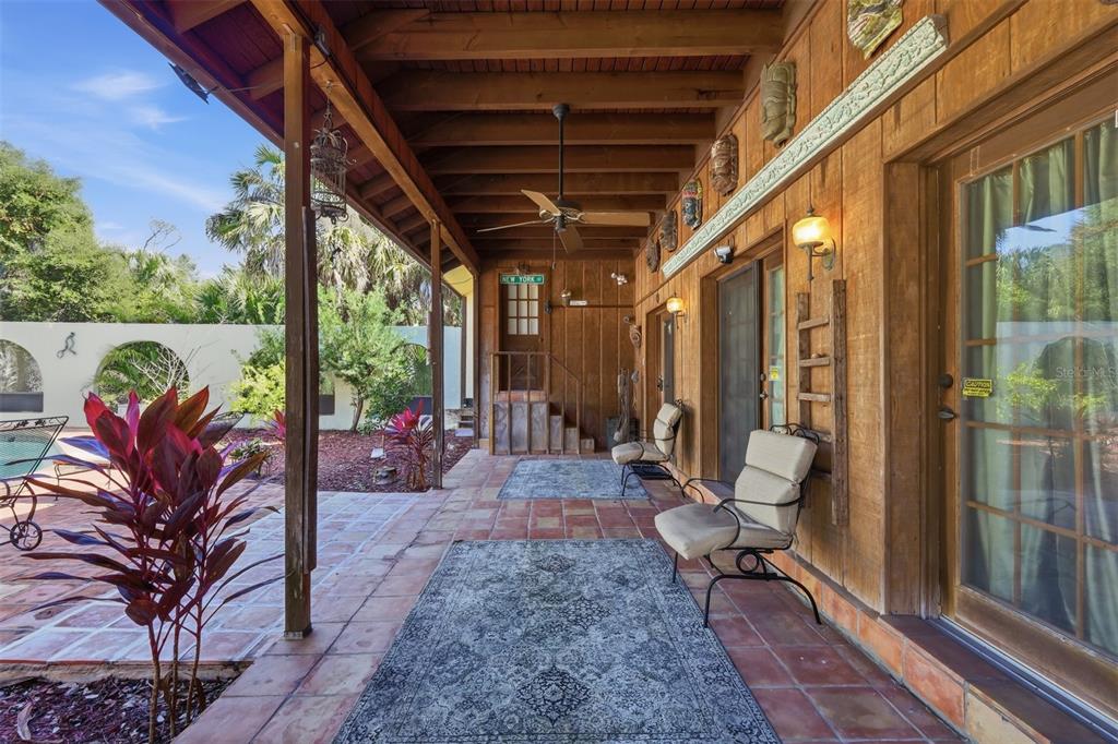1066 Conover Street Port Charlotte, FL 33952 - Photo 59 of 80 a view of a porch with furniture and wooden floor