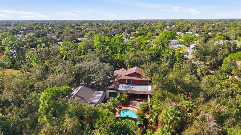 1066 Conover Street Port Charlotte, FL 33952 - Photo 77 of 80 an aerial view of a house with a yard