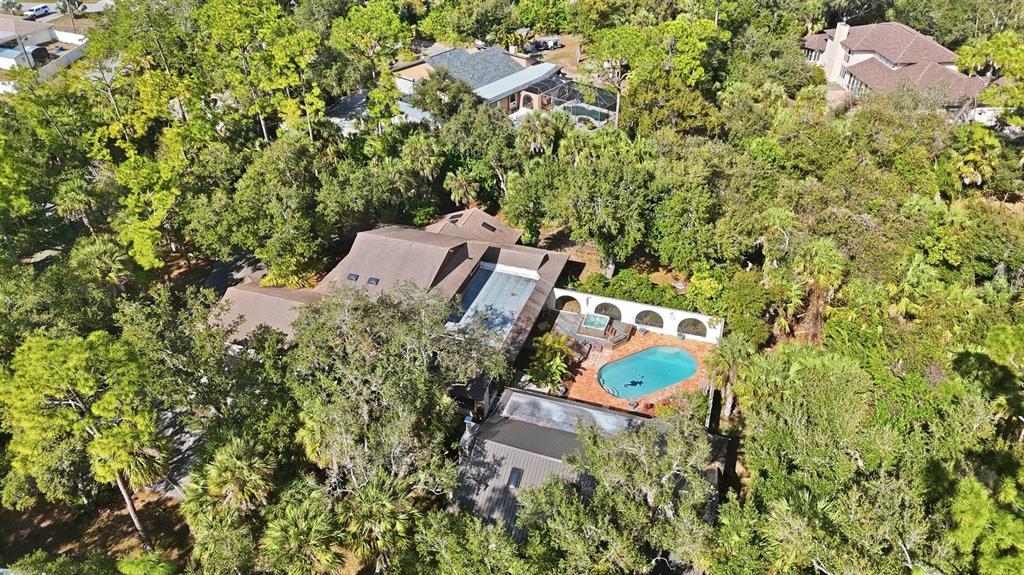 1066 Conover Street Port Charlotte, FL 33952 - Photo 79 of 80 an aerial view of a house with a yard and swimming pool