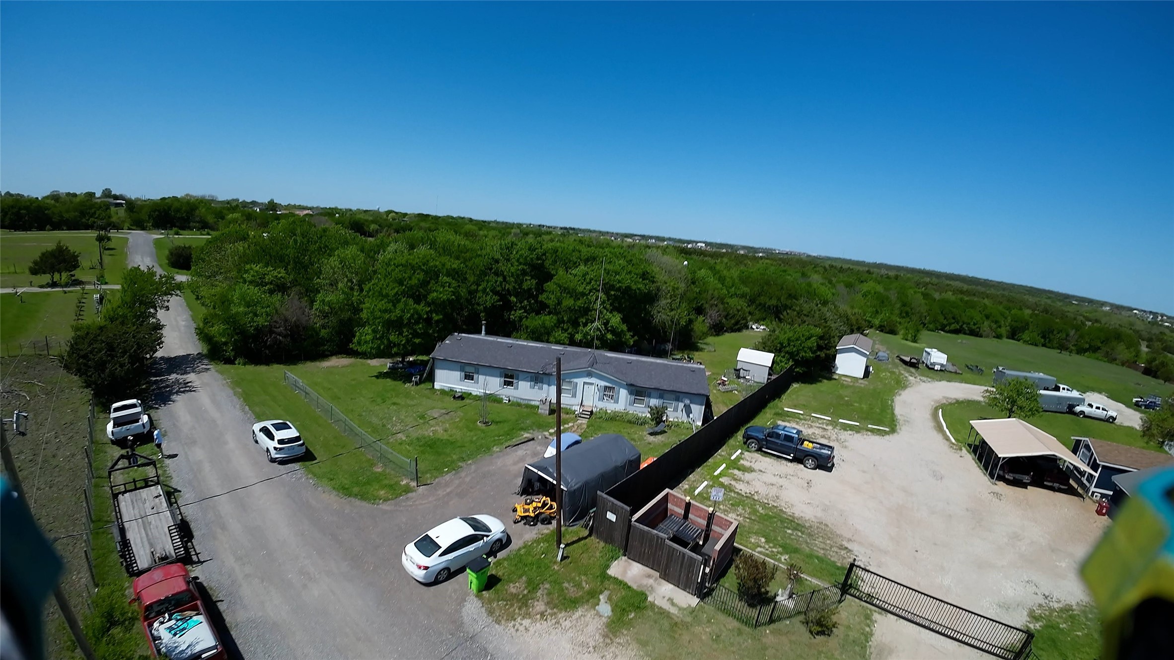 an aerial view of a house with outdoor space patio and outdoor seating