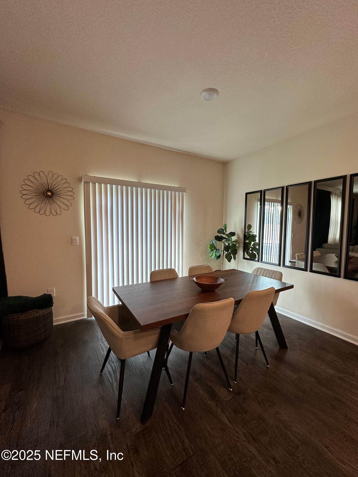 2062 Garrison Way Green Cove Springs Green Cove Springs, FL 32043 - Photo 19 of 56 a view of a dining room with furniture and wooden floor
