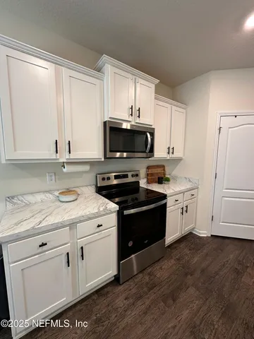 a bathroom with a sink toilet and tub