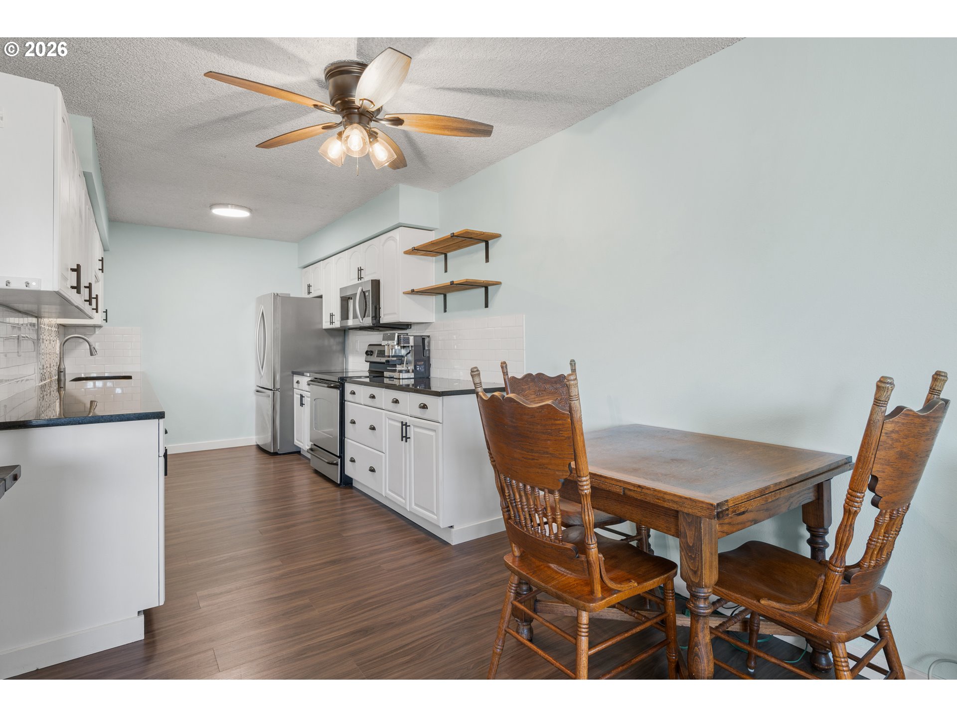 2727 Gateway Street, Unit 18 Springfield, OR 97477 - Photo 9 of 34 a view of a dining room with furniture and wooden floor