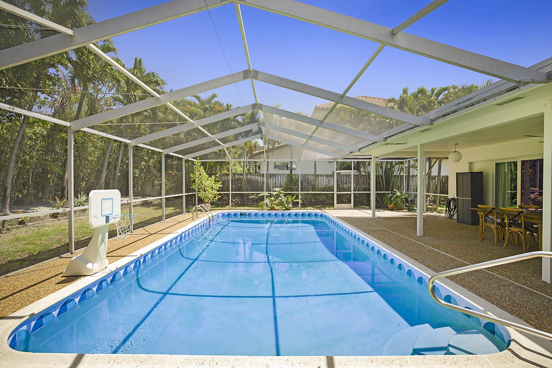 400 Northwest 6th Avenue Boca Raton, FL 33432 - Photo 1 of 44 a view of a backyard with swimming pool and sitting area