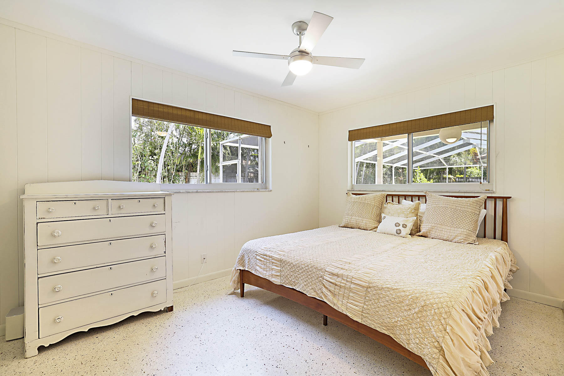 400 Northwest 6th Avenue Boca Raton, FL 33432 - Photo 24 of 44 a bedroom with a bed a dresser and a window