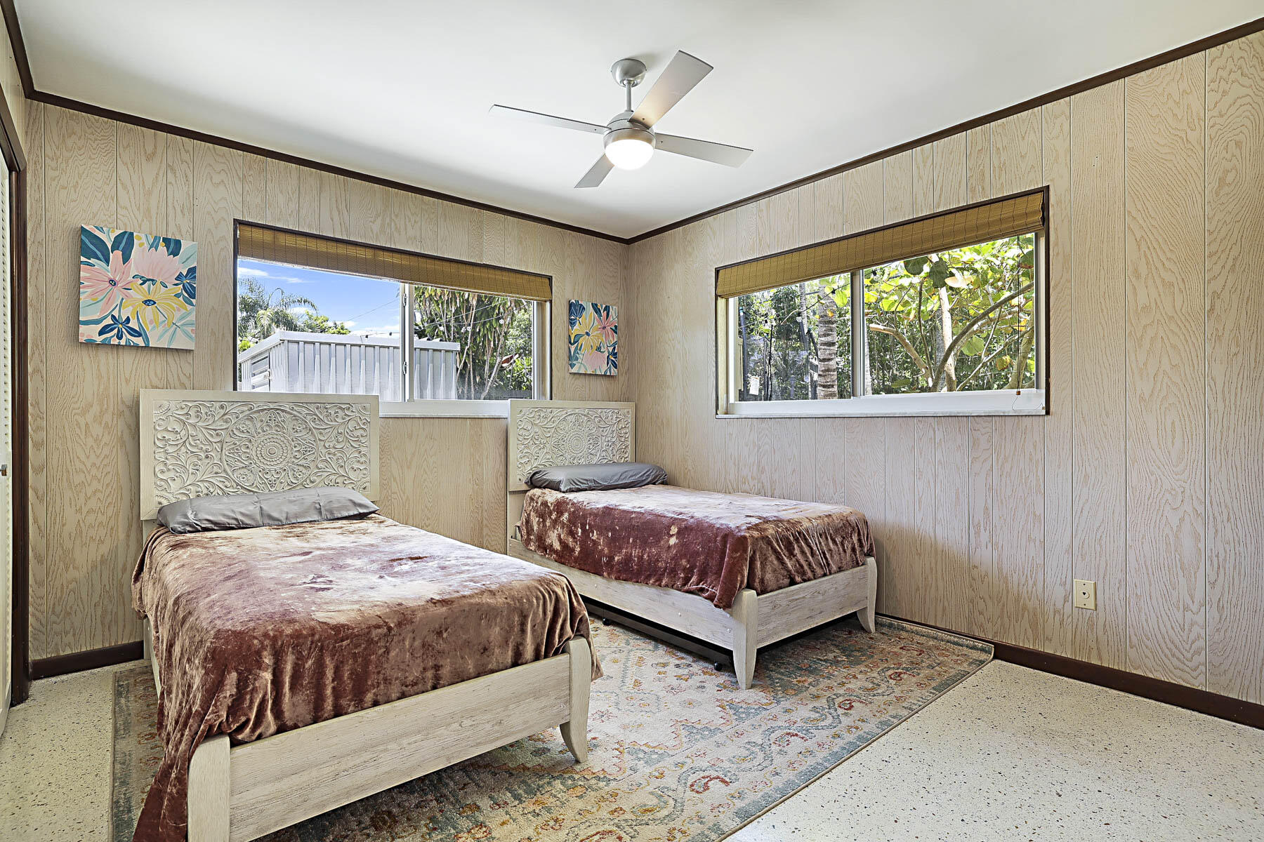 400 Northwest 6th Avenue Boca Raton, FL 33432 - Photo 28 of 44 a bedroom with a bed and a chandelier