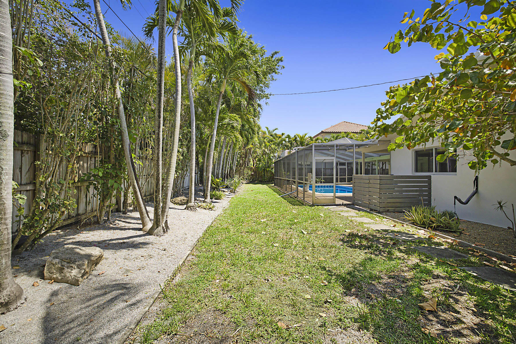 400 Northwest 6th Avenue Boca Raton, FL 33432 - Photo 40 of 44 a view of a house with a small yard and potted plants