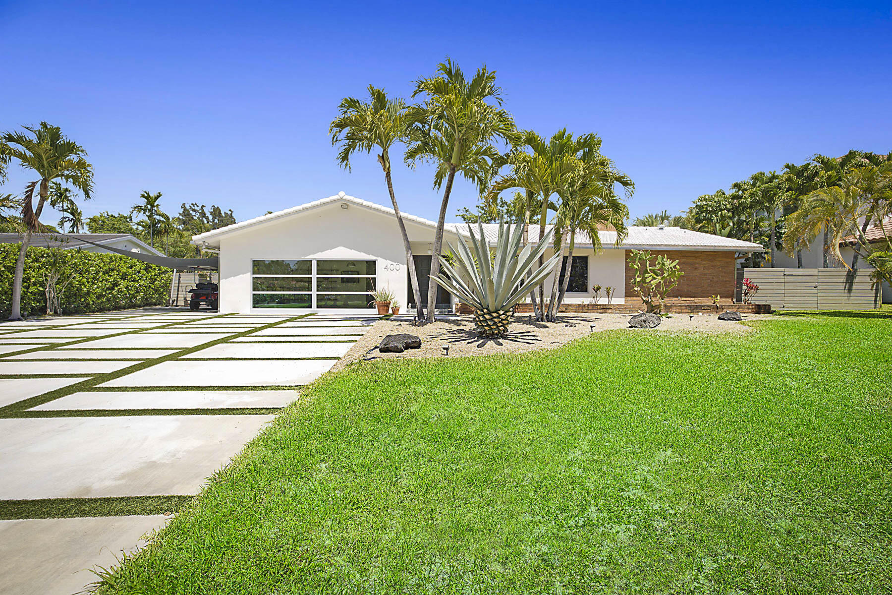 400 Northwest 6th Avenue Boca Raton, FL 33432 - Photo 4 of 44 a front view of a house with garden