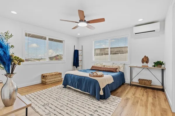 a bedroom with a bed and a table