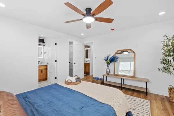 a bedroom with furniture and window