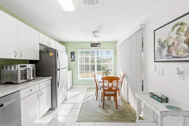 a view of a dining room with furniture and a window
