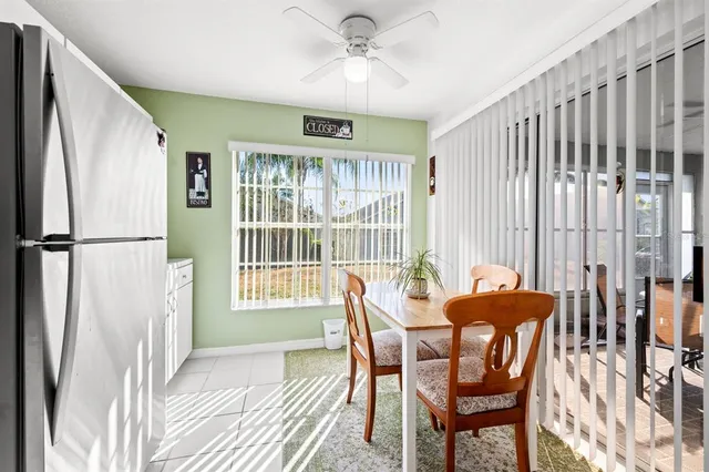 a kitchen with stainless steel appliances granite countertop a refrigerator sink and cabinets