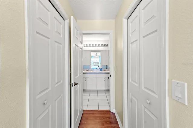 a bathroom with a sink vanity mirror and toilet