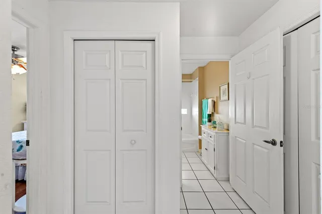 a bedroom with a bed and a desk