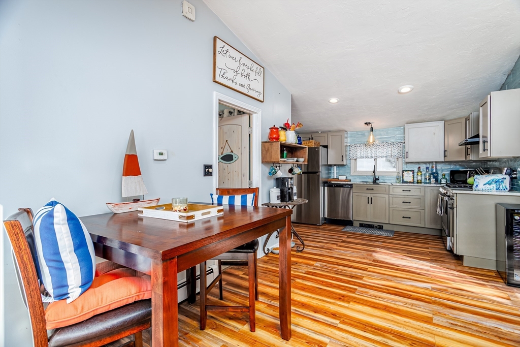 13 Browns Lake Road Ashburnham, MA 01430 - Photo 13 of 33 a dining room with furniture and a kitchen view