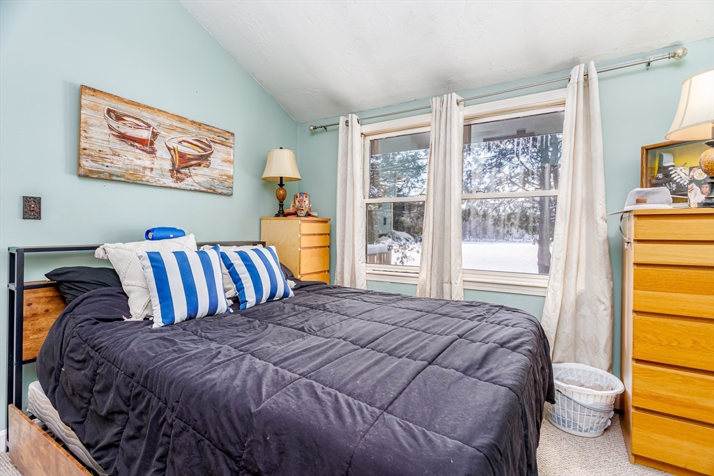 13 Browns Lake Road Ashburnham, MA 01430 - Photo 16 of 33 a bedroom with a bed and a window