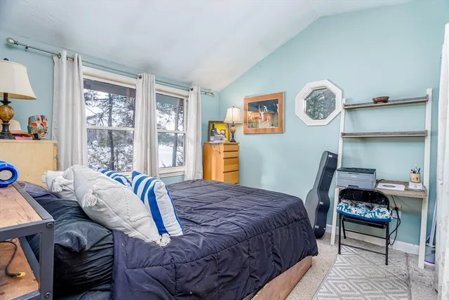 a bedroom with a large bed and a table