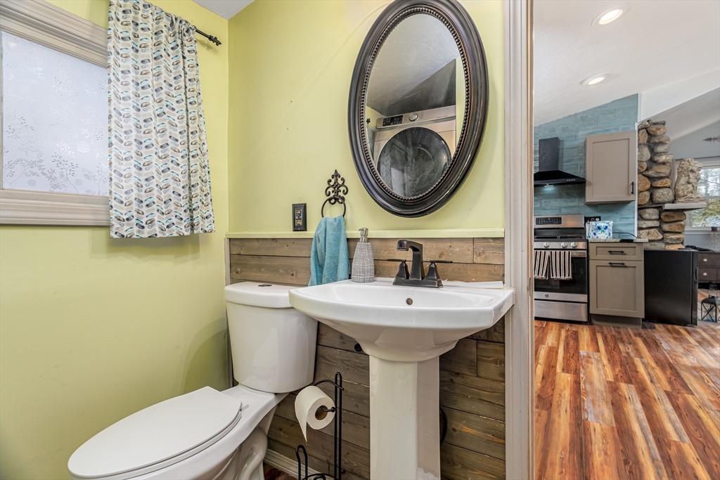 13 Browns Lake Road Ashburnham, MA 01430 - Photo 20 of 33 a bathroom with a sink a mirror a toilet and a mirror