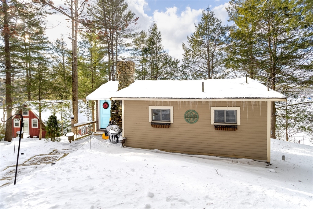 13 Browns Lake Road Ashburnham, MA 01430 - Photo 24 of 33 a view of a house with a yard covered in snow