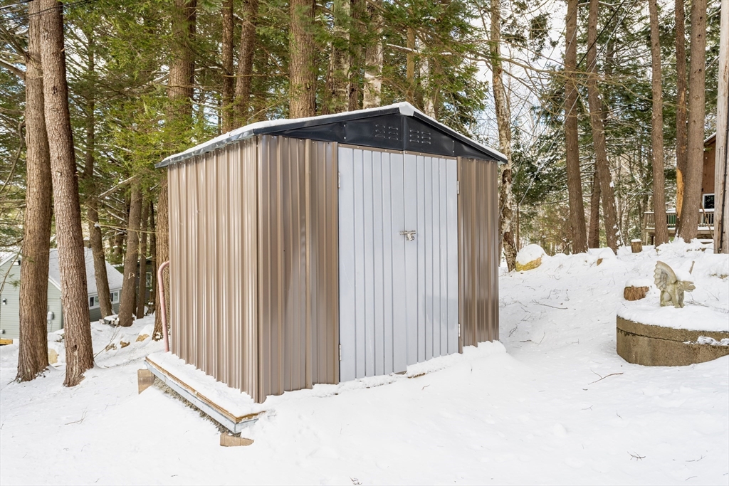 13 Browns Lake Road Ashburnham, MA 01430 - Photo 27 of 33 a view of a house with wooden fence and large trees