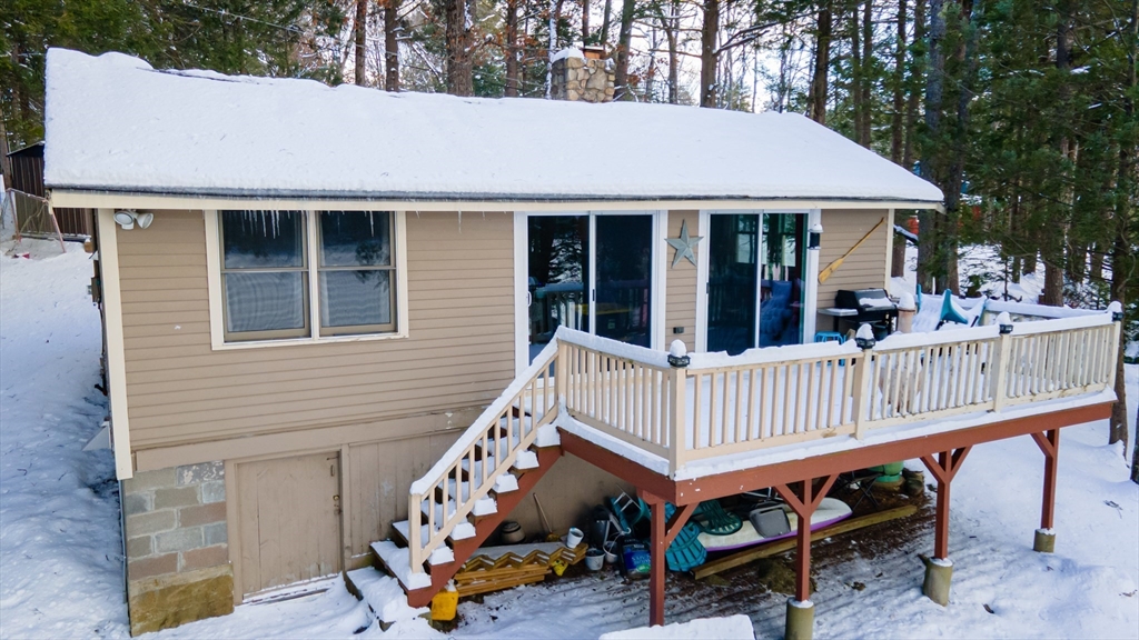 13 Browns Lake Road Ashburnham, MA 01430 - Photo 4 of 33 a view of a house with wooden deck and furniture