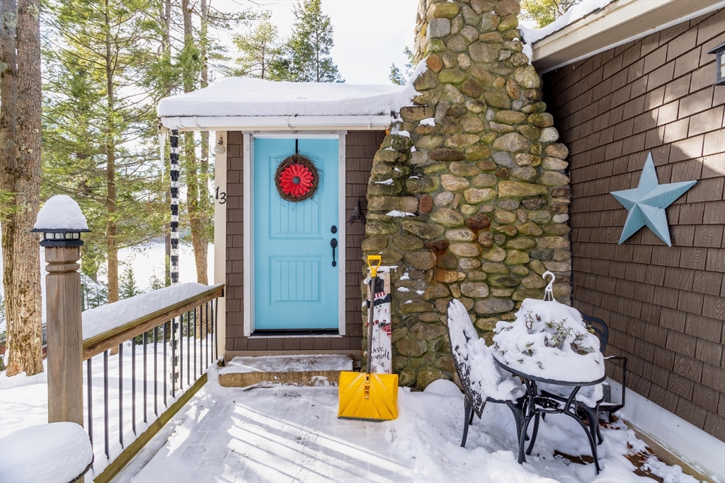 13 Browns Lake Road Ashburnham, MA 01430 - Photo 5 of 33 a view of a chairs and table in the balcony