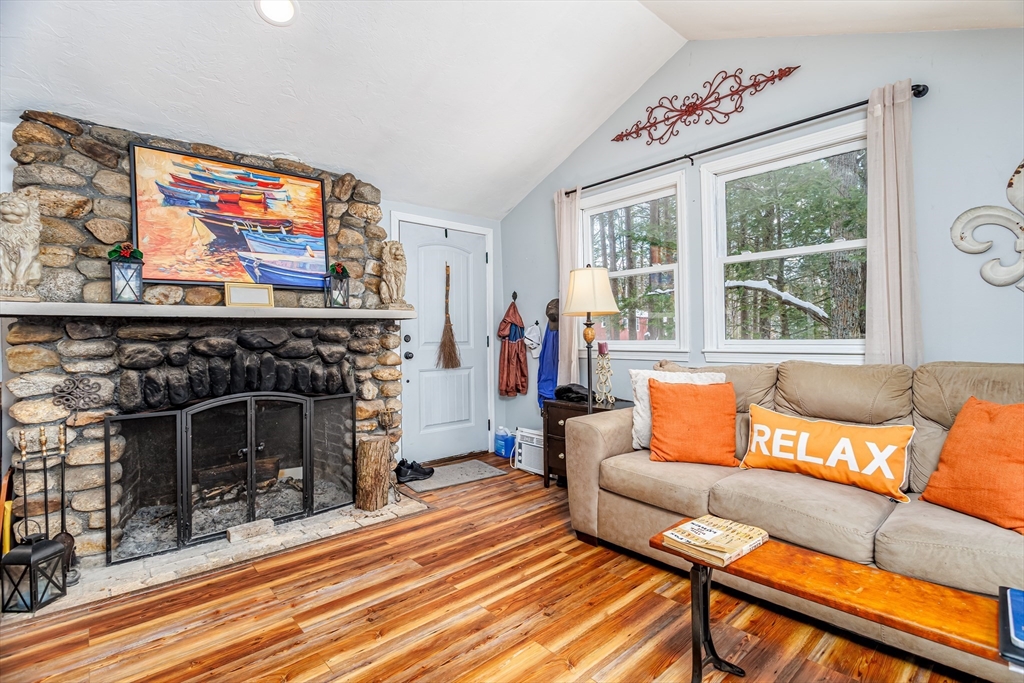 13 Browns Lake Road Ashburnham, MA 01430 - Photo 7 of 33 a living room with furniture and a fireplace