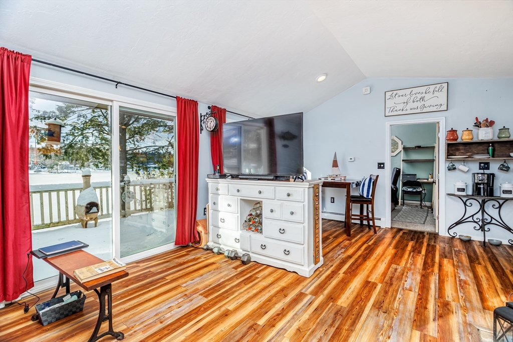 13 Browns Lake Road Ashburnham, MA 01430 - Photo 8 of 33 a room with furniture a flat screen tv and a table