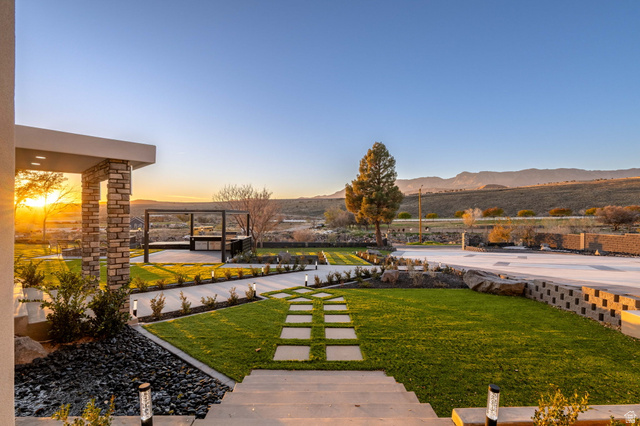 476 Spring Drive Toquerville, UT 84774 - Photo 89 of 95 Yard at dusk featuring a lawn, a mountain view, and a patio
