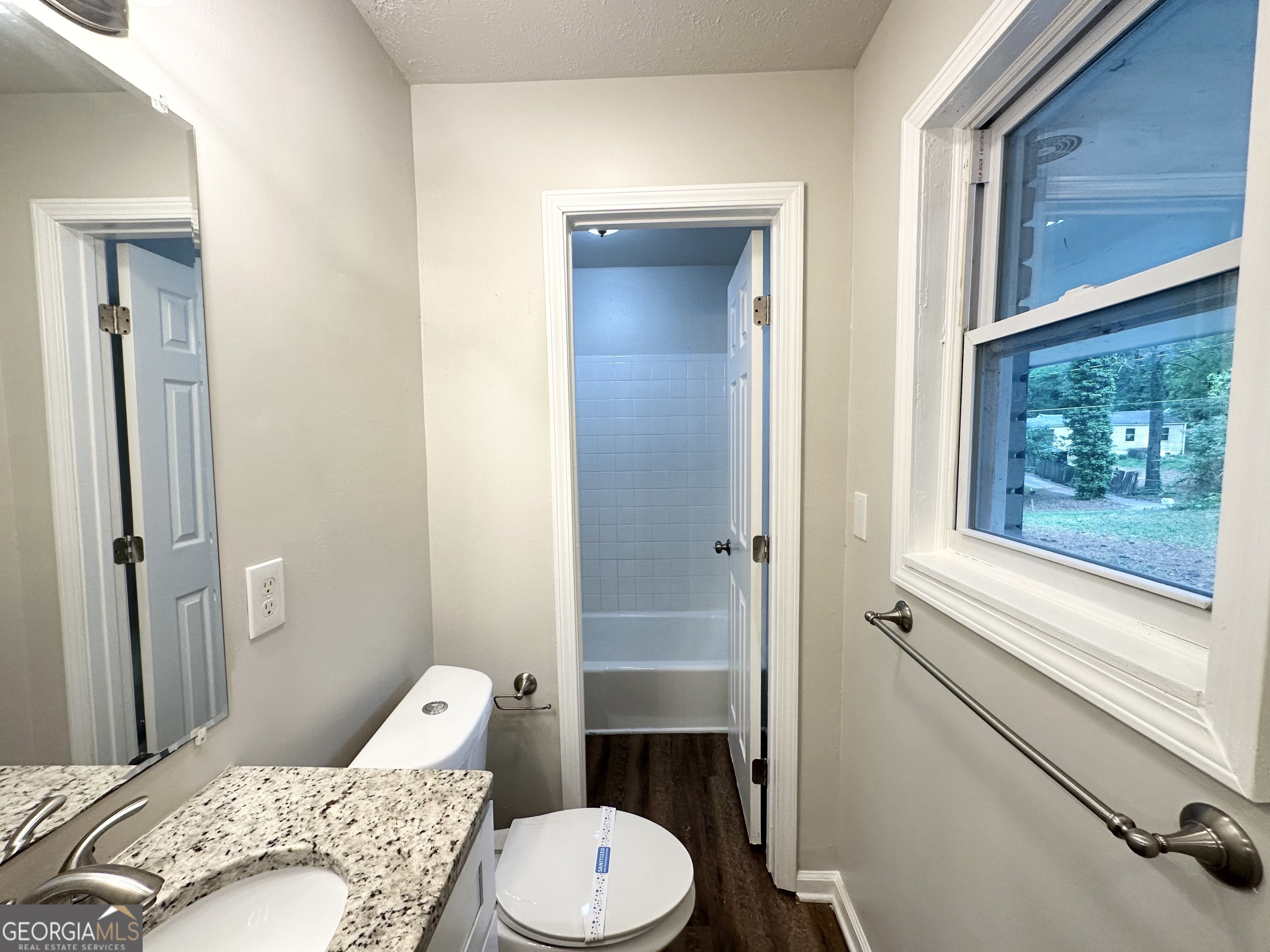 2930 Waters Road Southwest Atlanta, GA 30354 - Photo 12 of 14 a bathroom with a toilet sink and shower