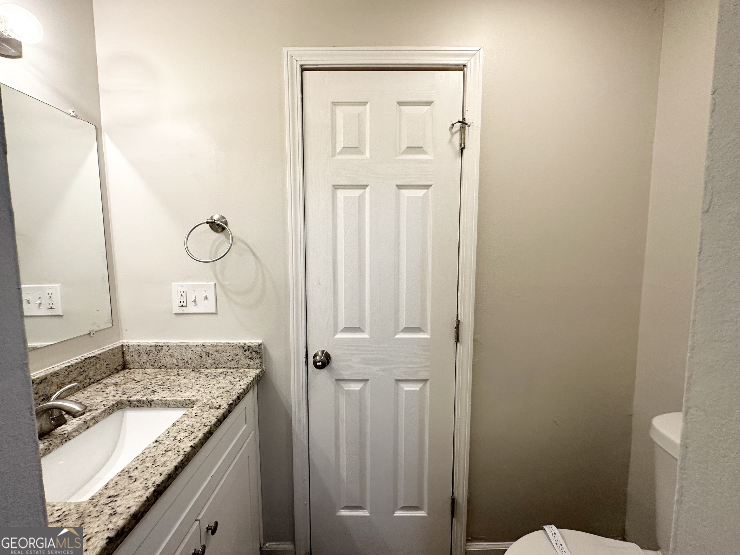 2930 Waters Road Southwest Atlanta, GA 30354 - Photo 13 of 14 a bathroom with a granite countertop sink and a mirror