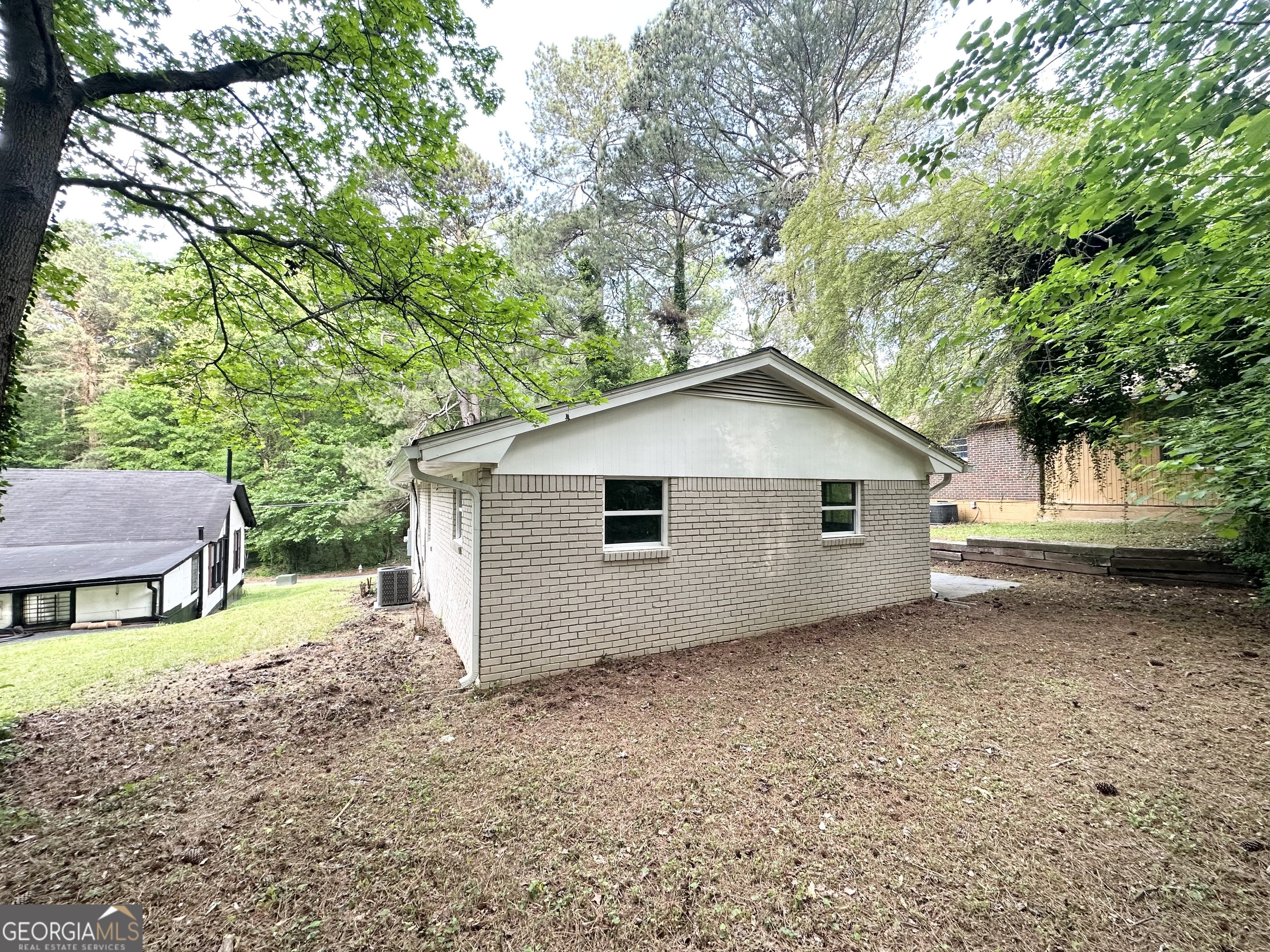 2930 Waters Road Southwest Atlanta, GA 30354 - Photo 14 of 14 a house with trees in front of it