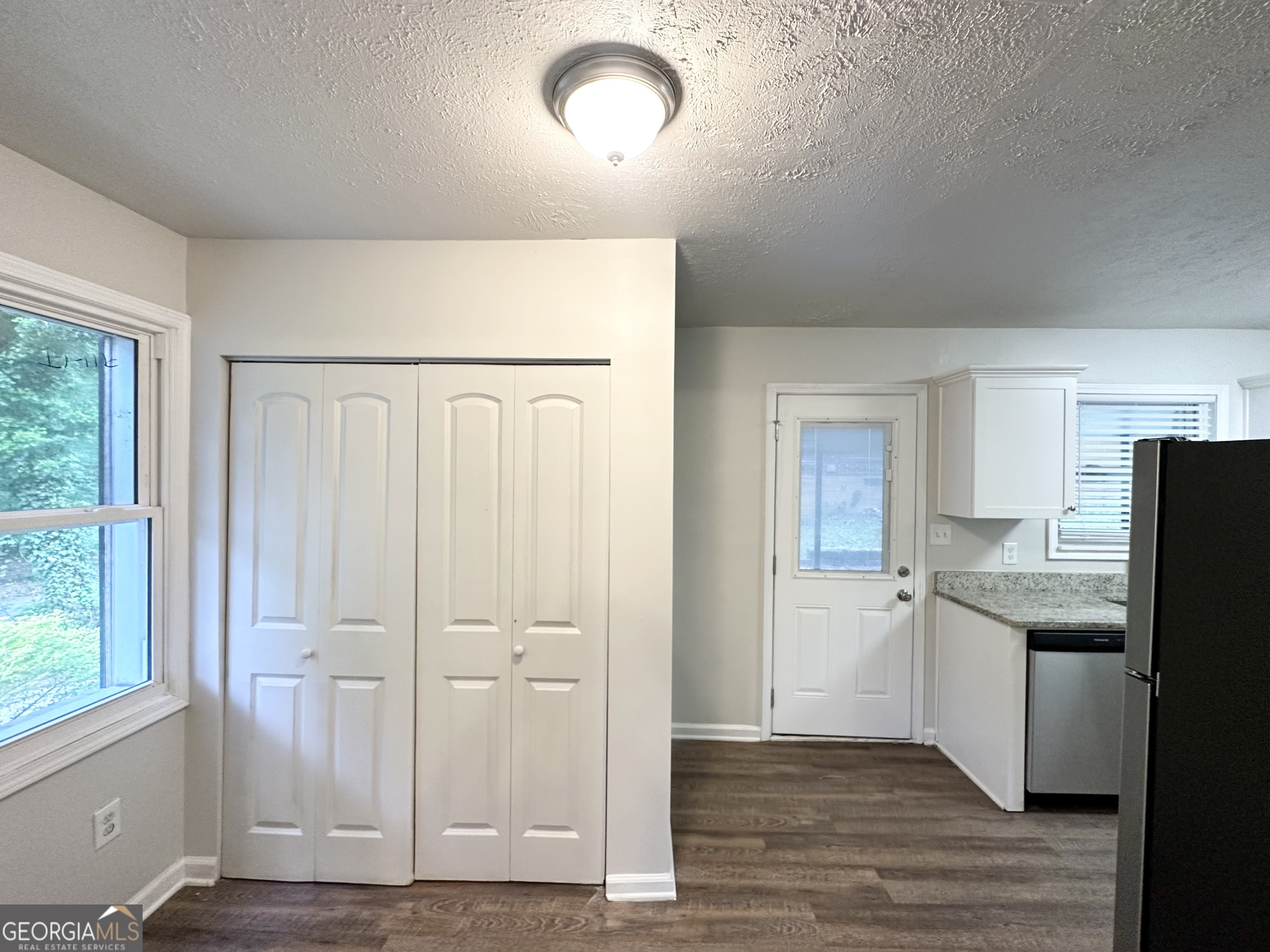 2930 Waters Road Southwest Atlanta, GA 30354 - Photo 4 of 14 a view of a kitchen with a sink and dishwasher refrigerator freezer