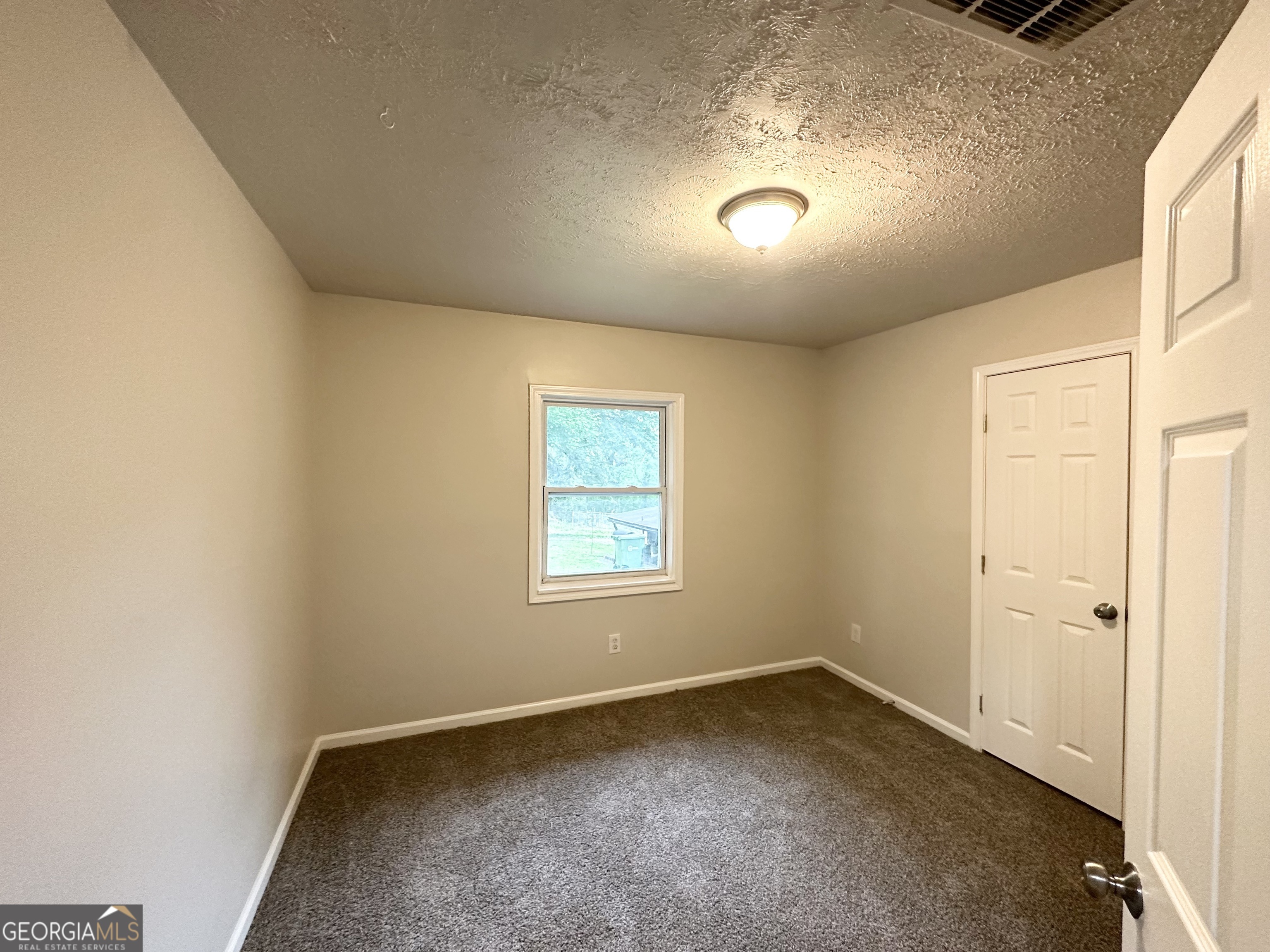 2930 Waters Road Southwest Atlanta, GA 30354 - Photo 6 of 14 an empty room with a window