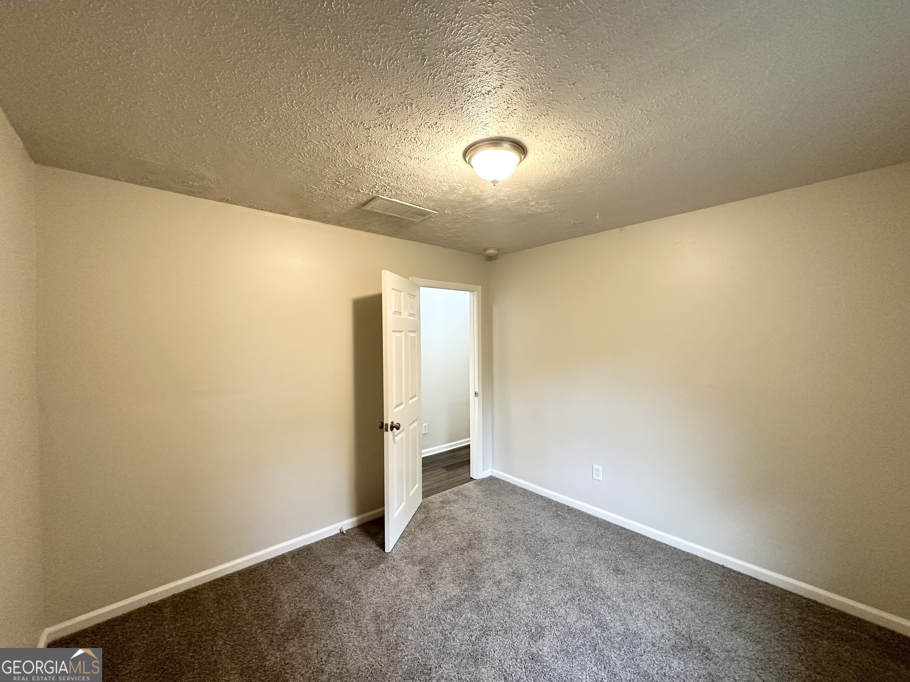 2930 Waters Road Southwest Atlanta, GA 30354 - Photo 7 of 14 an empty room with a empty space and a window